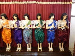 Mannequins inside the Hor Samritvimean wearing colourful costumes labelled as the days of the week.